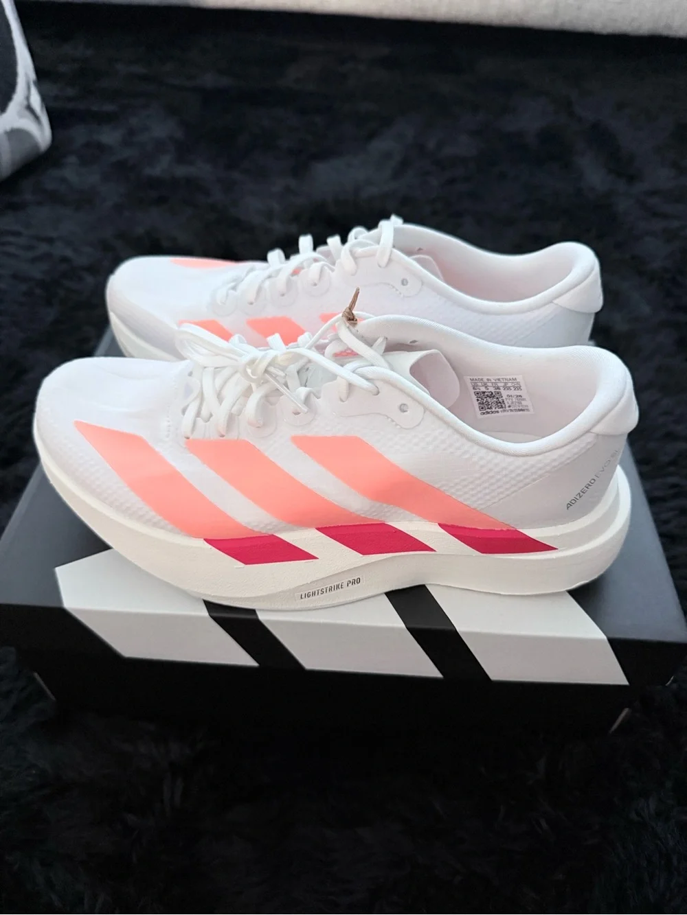Adidas Adizero Evo SL White Running Shoes, red and orange accents. Size 6.5